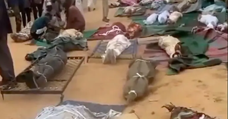 মসজিদের বাইরে রাখা নিহতদের মরদেহ